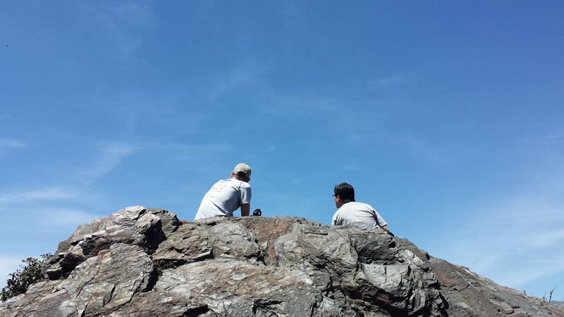 Eric and Jenwei sit at the high point for lunch.