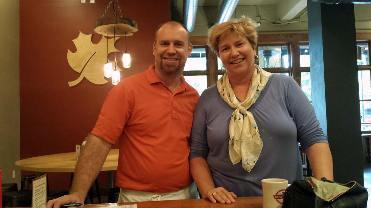 CSO executive director, Molly Sasse and owner Zeke discuss breakfast and coffee options for meetings.