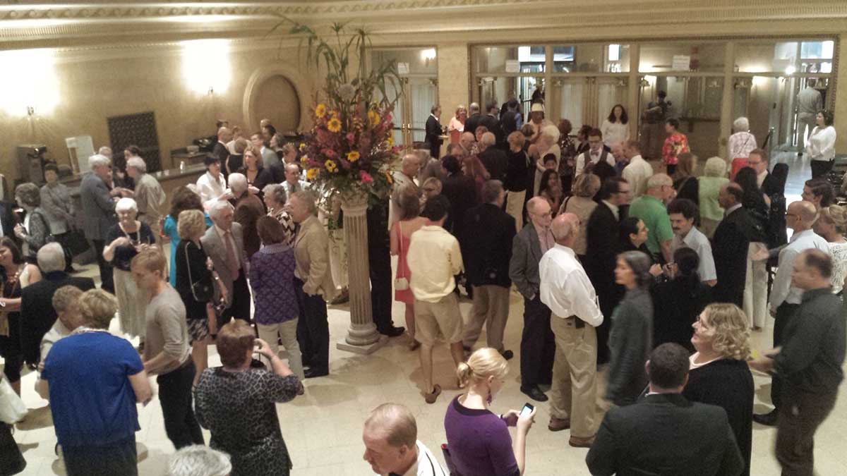 Audience enjoying the post-concert champagne and conversation